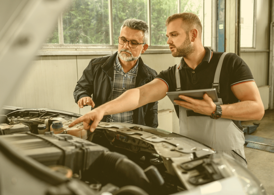 auto repair estimates illustration - mechanic and customer in a shop