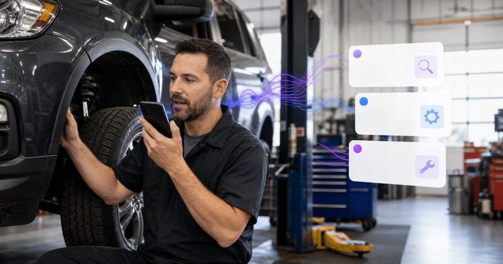 Technician using voice dictation while inspecting a vehicle in an auto repair shop